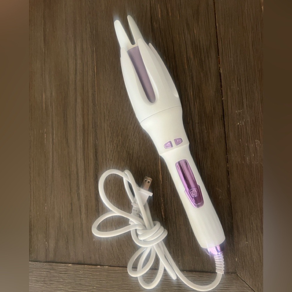 Rotating curling iron